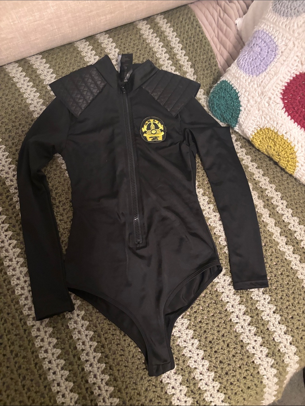 Leg Avenue Black Long-Sleeve Quilted Shoulder Bodysuit with Yellow Crest